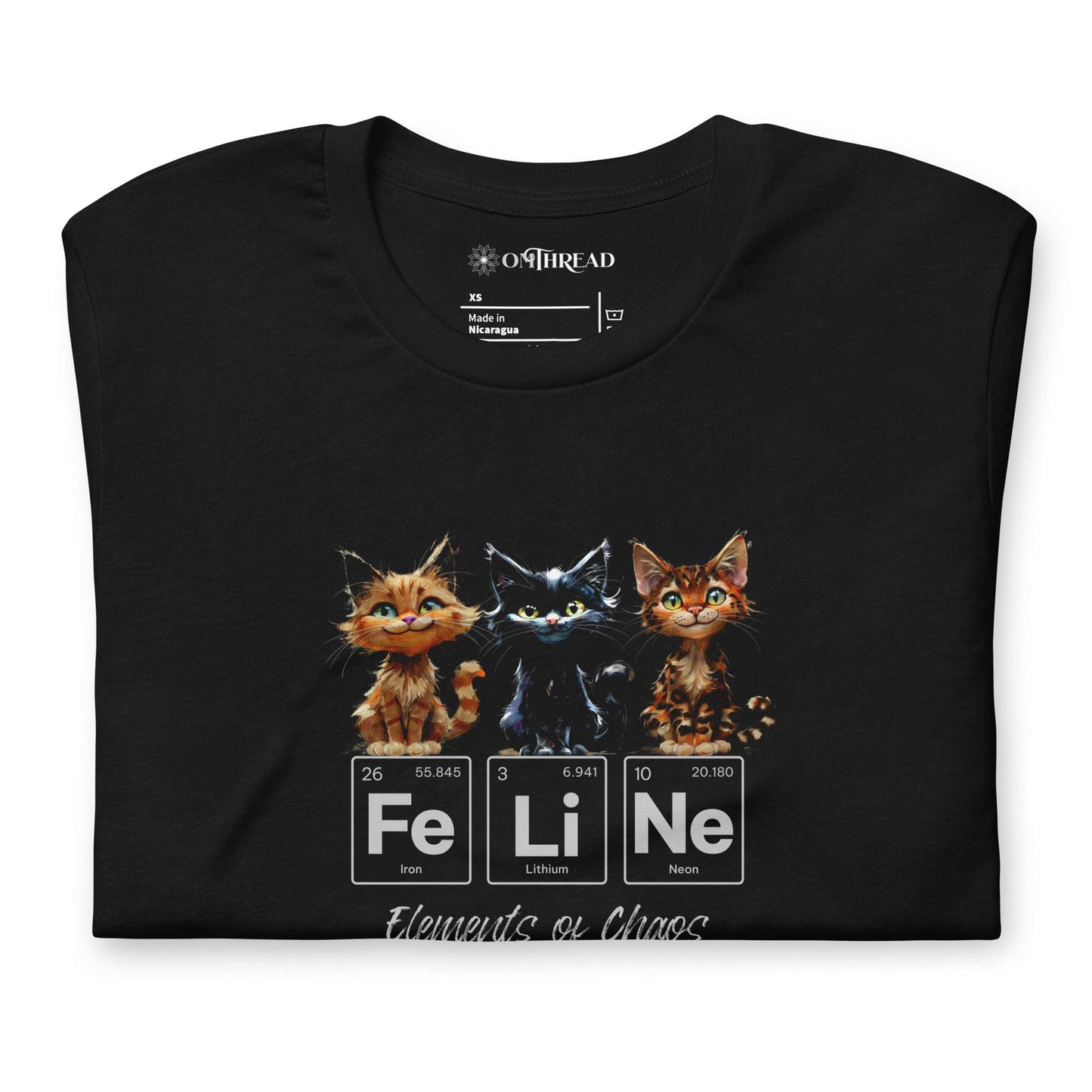 Black t-shirt featuring three mischievous kittens sitting above the word 'FeLiNe,' spelled out using periodic table elements: Iron (Fe), Lithium (Li), and Neon (Ne). Below, the phrase 'Elements of Chaos' is written in cursive font.