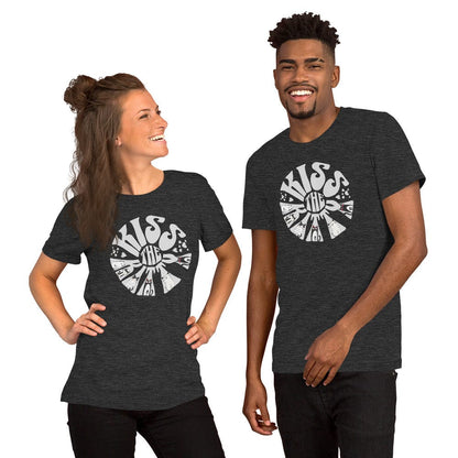 Man and woman wearing dark gray t-shirt with a circular, retro-style design that reads 'Kiss the Kitty.' The letters form a sunburst shape with playful illustrations of various cats integrated into the text and surrounding shapes.