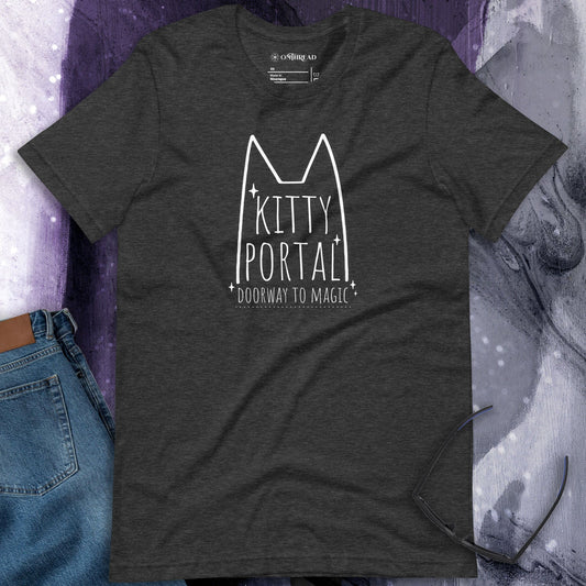 OMTHREAD dark gray t-shirt featuring a minimalist white cat outline with pointed ears, sparkling accents, and the text "Kitty Portal - Doorway to Magic" in a handwritten-style font.