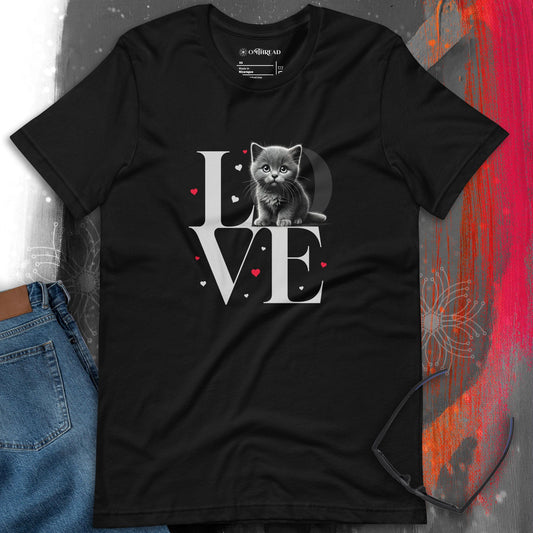 OMThread black t-shirt featuring a detailed design with the word "LOVE" in large serif letters. A gray kitten sits inside the letter "O," surrounded by small red and pink hearts.