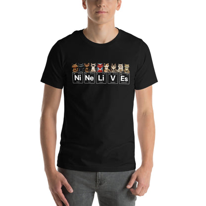 Male model wearing a black t-shirt featuring nine illustrated cats, each with a unique expression, sitting above periodic table elements that spell 'Ni Ne Li V Es' (Nickel, Neon, Lithium, Vanadium, and Einsteinium), representing 'Nine Lives.