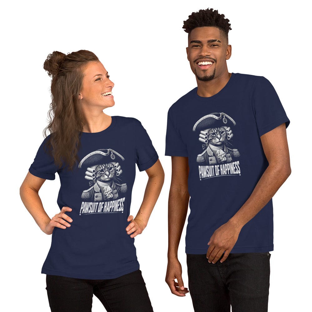 Man and woman wearing navy blue t-shirt featuring a humorous design of a cat dressed as a founding father in colonial attire, complete with a tricorne hat and glasses. The text, Pawsuit of Happiness is displayed below in bold, styled with stars and a decorative arch.