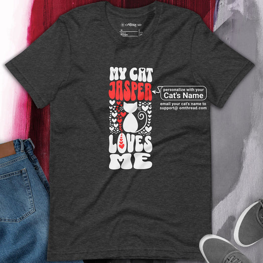 OMTHREAD dark gray t-shirt with a personalized design featuring the phrase "My Cat [Name] Loves Me" in bold white and red text, with a cat silhouette surrounded by heart graphics