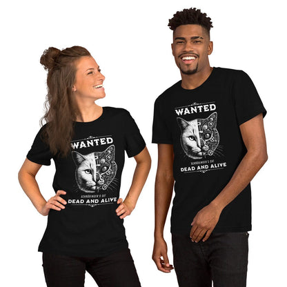 Models wearing a black t-shirt featuring a design of Schrödinger's Cat with the text 'WANTED' above and 'DEAD AND ALIVE' below. The cat's face is half-realistic and half-mechanical, showcasing gears and intricate machinery on one side.