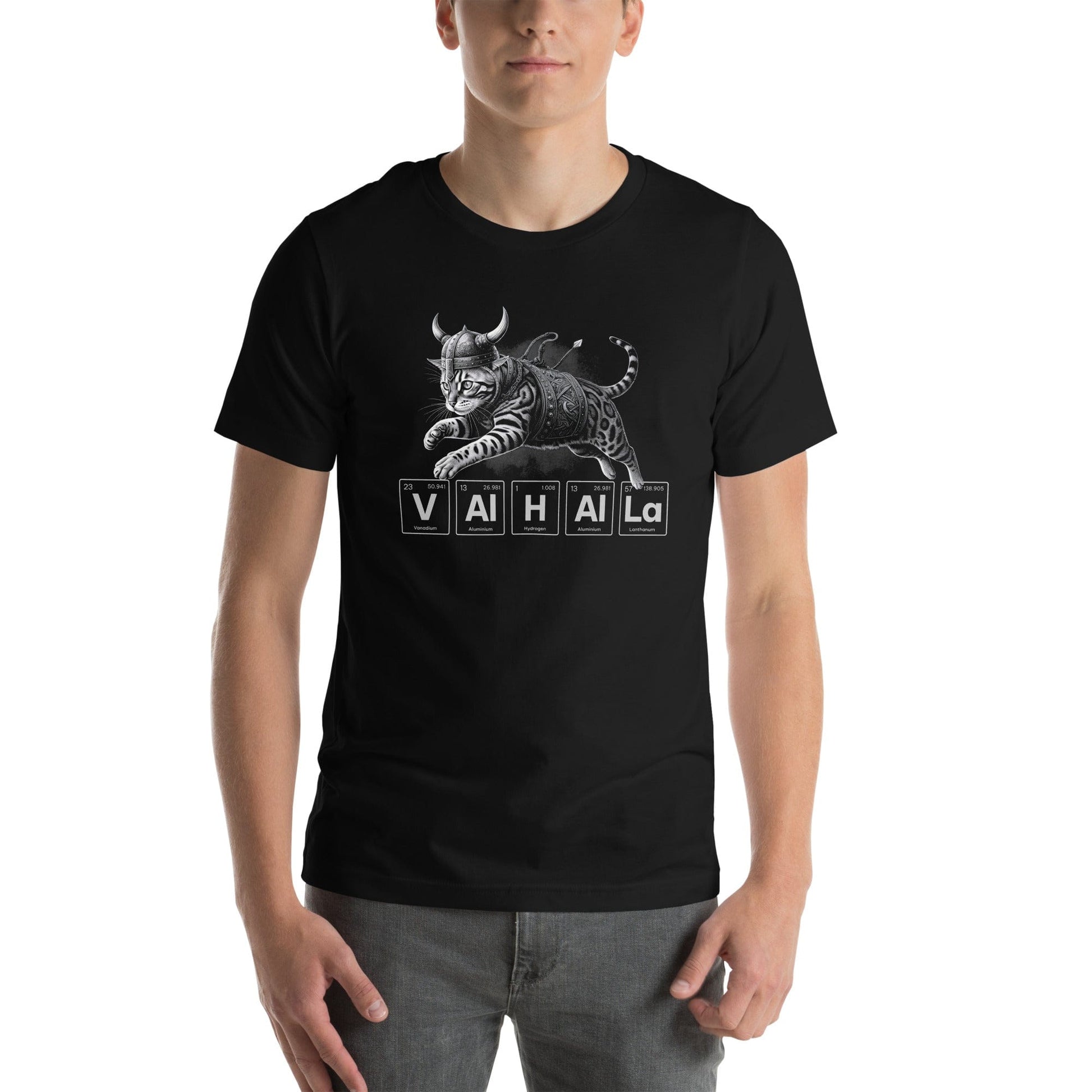 Man wearing black t-shirt featuring an illustration of a Viking-style armored cat in mid-leap. Below the cat, the word 'VALHALLA' is spelled out using periodic table elements: Vanadium (V), Aluminum (Al), Hydrogen (H), Aluminum (Al), Aluminum (Al), and Lanthanum (La).