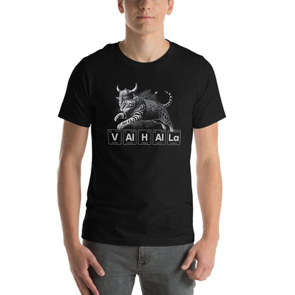 Man wearing black t-shirt featuring an illustration of a Viking-style armored cat in mid-leap. Below the cat, the word 'VALHALLA' is spelled out using periodic table elements: Vanadium (V), Aluminum (Al), Hydrogen (H), Aluminum (Al), Aluminum (Al), and Lanthanum (La).