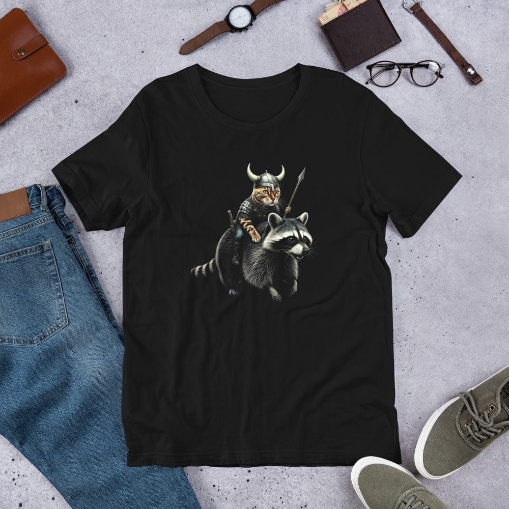 A black t-shirt featuring a detailed illustration of a Viking cat wearing a horned helmet and armor, holding a spear, and riding a fierce-looking raccoon. 