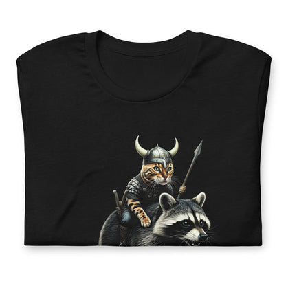 A black t-shirt featuring a detailed illustration of a Viking cat wearing a horned helmet and armor, holding a spear, and riding a fierce-looking raccoon. 