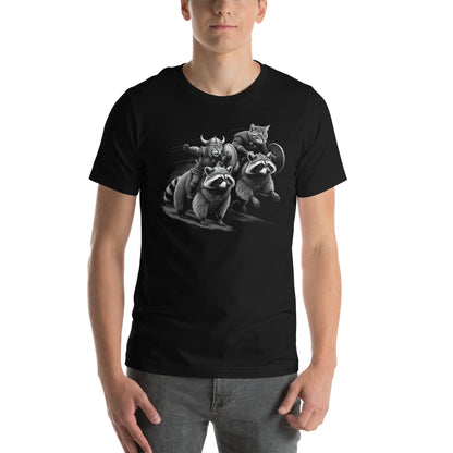 Man wearing black t-shirt featuring two Viking cats wearing armor and helmets, riding armored raccoons. One cat holds a sword, and the other carries a shield. The design is detailed with dynamic movement and intricate linework.