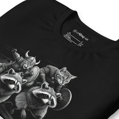 Black t-shirt featuring two Viking cats wearing armor and helmets, riding armored raccoons. One cat holds a sword, and the other carries a shield. The design is detailed with dynamic movement and intricate linework.