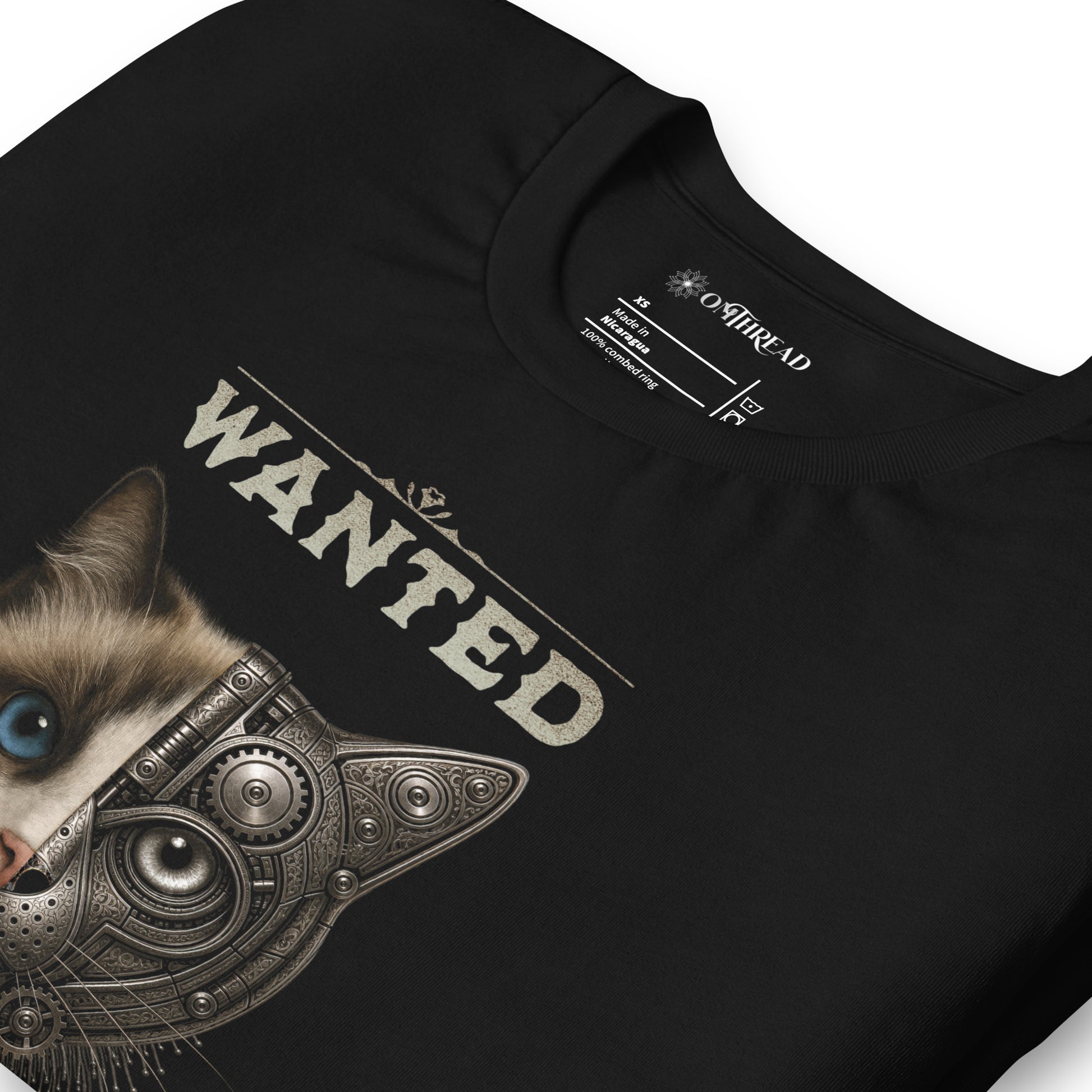 OMThread black t-shirt featuring a ragdoll cat face with blue eye split between realistic and mechanical halves with Schrodinger cat dead and alive text in a wanted poster style design